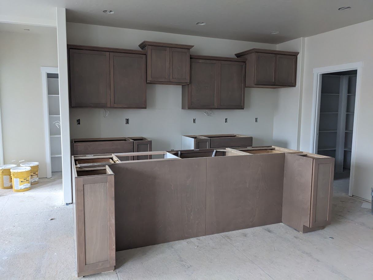 Kitchen island cabinetry mid-installation