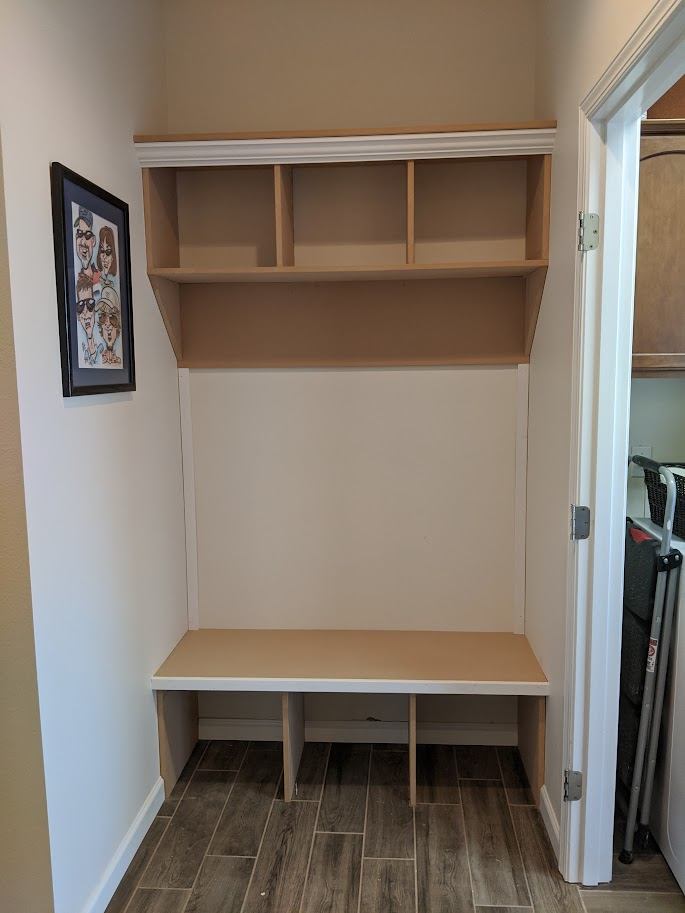 Mudroom bench and cubby unit being installed
