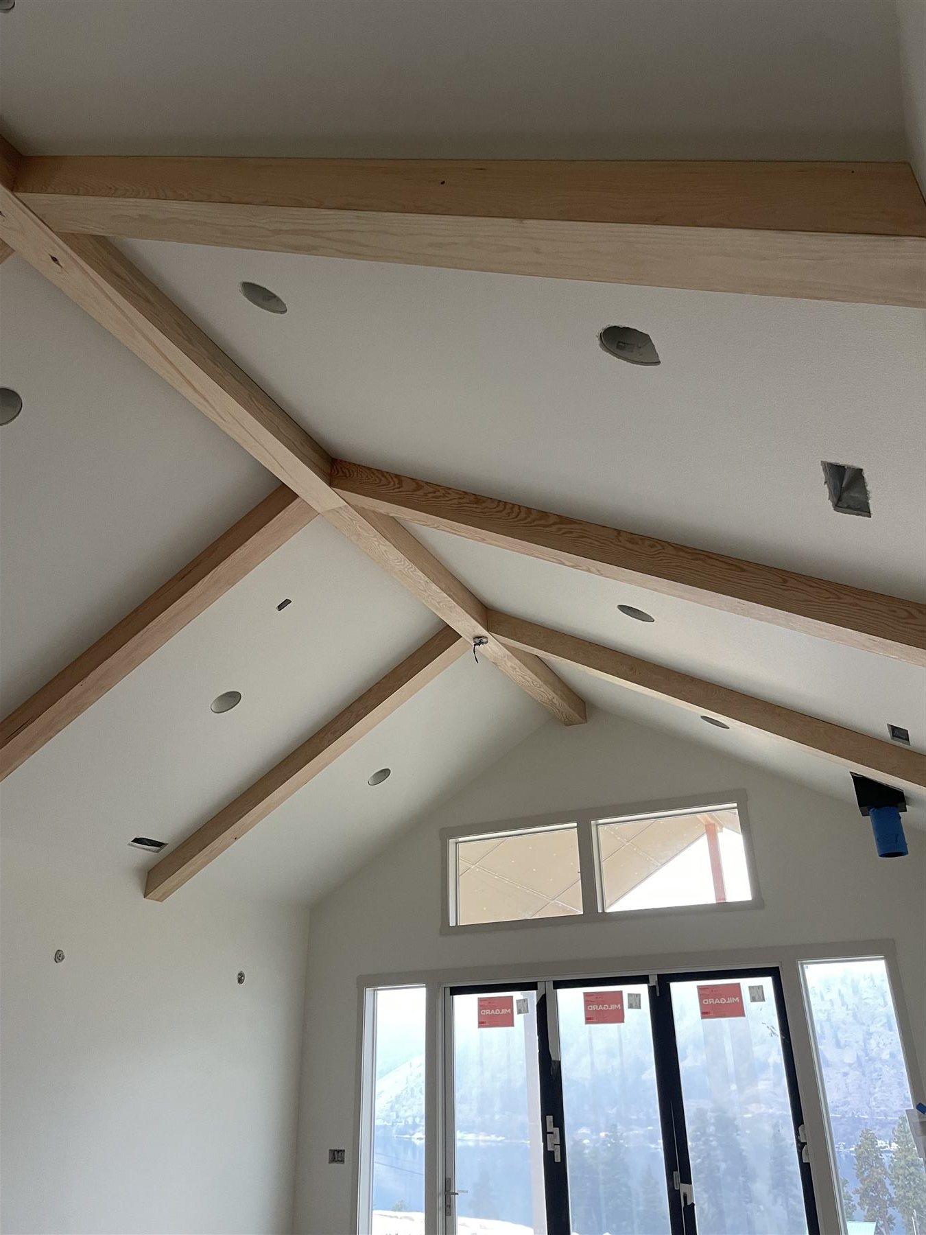 Exposed vaulted ceiling beams during construction
