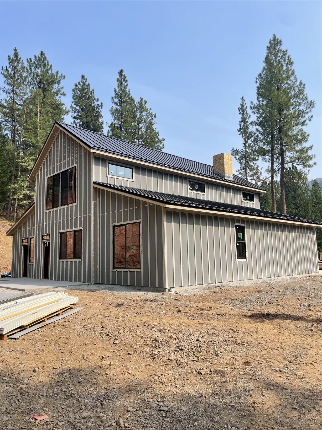 Large finished board-and-batten addition with a metal roof