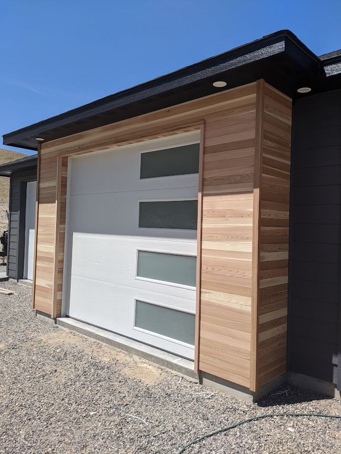 Wide side angle of the finished cedar-clad addition